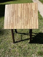 Top-down view showing the wood laminate surface and adjustable tabletop.