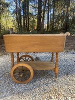 Photo of the full tea cart outdoors on gravel, showing the rectangular top and legs.