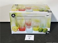 Photo of the unopened box packaging for the 12-piece acrylic drinkware set showing product branding and details.