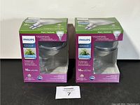 Two boxed Philips LED plant grow lights displayed side by side showing front of packaging.