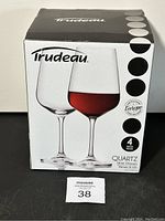 Box of Trudeau Quartz wine glasses, showing brand and product images of red and white wine glasses, indicating European craftsmanship and set of 4 pieces.
