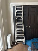 Front view of ladder in A-frame configuration showing full height and stance