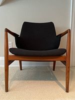 Front view of lounge chair, showing seat cushion and frame.