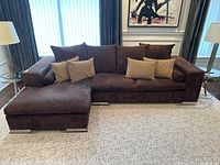 Front view of sectional sofa with chaise and throw pillows