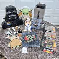Overview of the Star Wars toy assortment including masks, plush, figures, book, and packages.