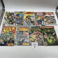 Front view of all 10 vintage comic books arranged facing up.