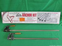 Arrow Auger Anchor Kit box showing brand, product details, and four stakes included.
