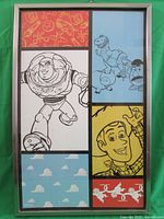 Framed wall art showing multiple panels with Toy Story characters including Buzz Lightyear in a dynamic pose, Woody with a hat, and additional characters in sketches and colorful backgrounds.