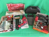Full view of the tool lot including hammer drill, wrench set, socket set, Allen keys, and screwdriver set