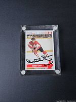 Front of Bobby Orr hockey card showing player image with autograph and Team Canada labeling.