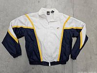 Front view of vintage USA Olympic nylon jacket, showing color blocking and embroidered logo.