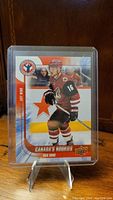 Front photo of Max Domi rookie hockey card in protective sleeve on stand