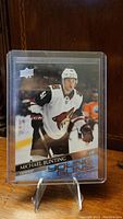 Front of the Michael Bunting rookie card featuring player in Arizona Coyotes uniform.