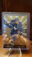 Front view of Nick Robertson rookie hockey card in plastic sleeve on clear stand