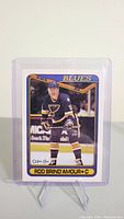 Front side of Rod Brind'Amour rookie card showing player image and card details in St. Louis Blues uniform