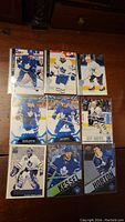 First photo showing nine Toronto Maple Leafs hockey cards featuring goaltenders and skaters in blue and white jerseys.