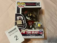 Tom Brady Funko POP! vinyl figure in original box, showing full front packaging and figure inside.