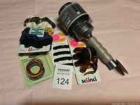 Photo showing new hair accessories including scrunchies, hair elastics, claw clips, hair pins, and vent brush.