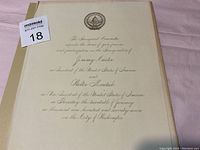 Front page of the inauguration invitation showing the embossed presidential seal and formal engraved text inviting to the inauguration of Jimmy Carter and Walter Mondale on January 20, 1977.