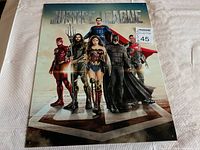 Front view of the Justice League replica tin sign showing main characters and title.