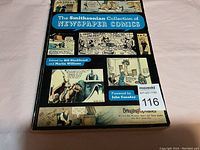 Photo of the front cover of The Smithsonian Collection of Newspaper Comics book showing the title, editors, and comic illustrations on the cover.