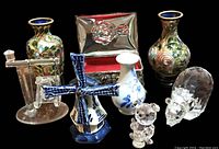 Photo showing entire collection of seven miniature decorative items on black background
