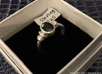 Front view of the sterling silver ring showing the black stone and 'Sterling .925' label