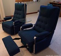 Front view of two matching recliner chairs and floor lamp with glass side-table