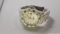 White ceramic Toy Watch Co O.o wristwatch showing dial, bezel, and bracelet detail.