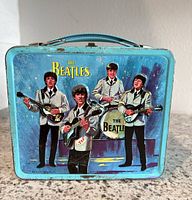 Front panel with Beatles performing scene and The Beatles logo