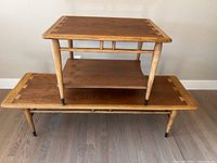 Side table placed on top of coffee table stacked against wall