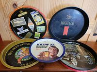 Photo showing all 5 advertising bar trays arranged together, displaying various brand logos and designs.