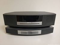 Front view of stacked main unit and 3-disc CD changer