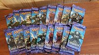 Image of 18 Magic: The Gathering sealed booster packs from the 2012 Return to Ravnica expansion, showing full front packaging artwork in blue and purple tones.