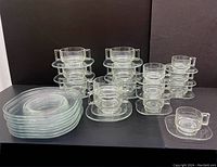 Overview of stacked dinner plates, salad plates, soup bowls, cups and saucers