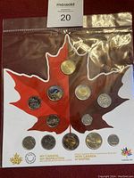 2017 Canadian coin collection displayed on a maple leaf card featuring various denominations and commemorative designs.