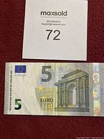 Front side of 5 Euro banknote showing architectural arch, Euro symbols and denomination 5