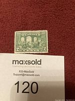 1927 Canada Confederation 2 cent postage stamp displayed on burgundy background with lot tag visible
