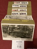 Image showing 12 Canadian postage stamps featuring different locomotives and the informational booklet titled 'Canadian Locomotives Les locomotives canadiennes'. Booklet cover displays a black and white photo of a historic steam locomotive numbered 2456.