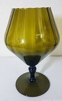Front view of the vintage mid-century modern Empoli green art glass vase on a white background.