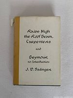 Front cover of Raise High the Roof Beam, Carpenters and Seymour by J.D. Salinger showing title and author on original dust jacket with yellow spine.