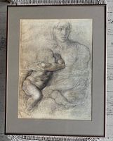 Full view of framed Michaelangelo unfinished drawing print depicting a woman with a child, mounted on a white mat inside a dark frame.