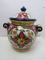 Front view of Vallarta ceramic cookie jar showing floral hand-painted design, lid, and side handles.