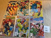 Six Spider-Man comics displayed on table, showing all front covers, each bagged and boarded.