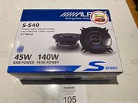 Top view of the Alpine S-S40 car speakers box showing model, power ratings, and speaker image.