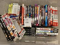 Top-down photo of the 41 manga volumes arranged in rows, showing varied colorful spines with titles and volume numbers.