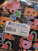 Close-up of the wrapping paper design with a label showing size and price.