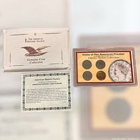 Coins and certificate with original sleeve from The American Historic Society