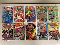 Full view of all 10 Arak Son of Thunder comic books laid out flat showing front covers.