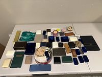 Overall assortment of jewelry boxes arranged on a flat surface